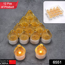 Twelve golden mesh LED tea lights arranged in a pyramid, with two in front, on a dark grey surface.
