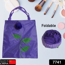 Two views of the eco-friendly foldable shopping bag, one folded into a rose and one fully open.