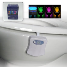 White motion sensor toilet bowl light attached to a toilet rim, with an inset of the product packaging and glowing toilet