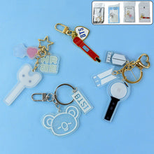 Acrylic and metal keychain featuring a microphone design