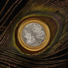 Intricate Lakshmi Ganesh embossed design on decorative religious coin