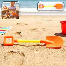 Kids beach sand shovel with wide scoop lying on sandy surface