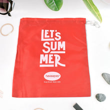 A red drawstring bag with 