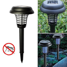 Garden Vera solar mosquito trap and garden light illuminating an outdoor space.
