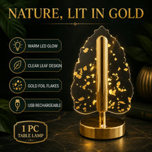 A golden crystal leaf LED table lamp on a dark surface with text highlighting its features like warm glow and USB