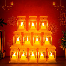 Twelve clear plastic lanterns with glowing LED candles arranged in a pyramid on a red background with festive patterns.