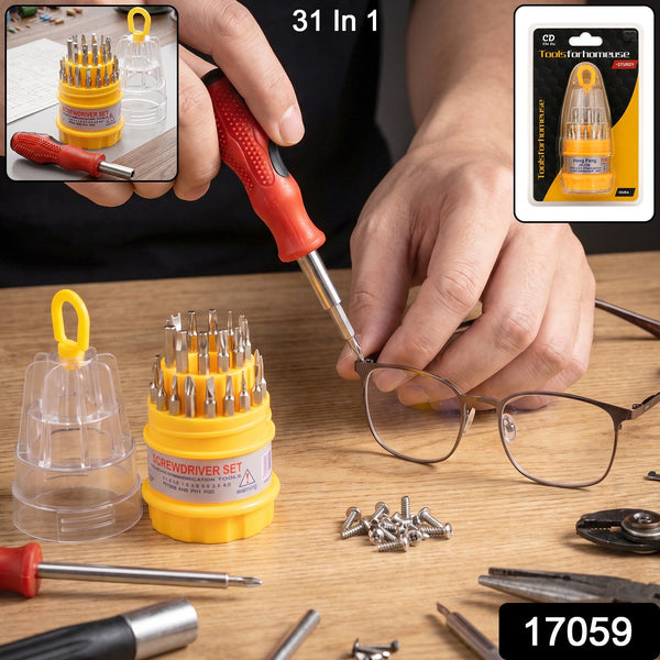 A person uses a red and black screwdriver to tighten a screw on a pair of glasses, with the screwdriver set