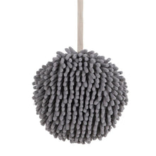 Plush hanging hand towel with convenient loop for easy placement.