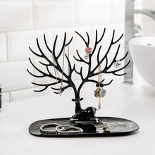 Side view of deer shaped jewellery holder showcasing antler branches and oval tray