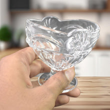 A single glass ice cream cup featuring the classic tulip shape.