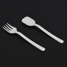 A pack of Quickslice disposable plastic forks and spoons, ideal for party supplies.