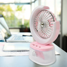 Portable humidifying fan releasing fine mist for cooling and skin moisturization.