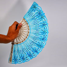 Chinese vintage folding fan with floral designs, ideal for decoration and cooling. Comes with a protective fabric sleeve.