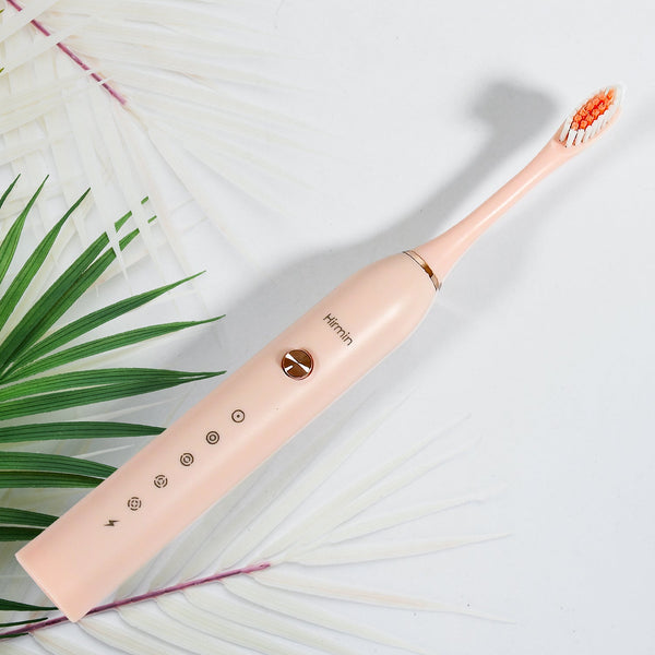BrushedUp Electric Toothbrush in white, showcasing its sleek design and brush head.