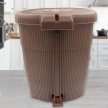 Sleek mini pedal dustbin discreetly positioned in an office workspace.