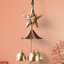 Dragonfly wind chime producing soft relaxing tones in a patio outdoor setting