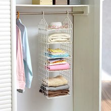 White 5-layer plastic hanging closet organizer with folded clothes and a hat in a white closet.