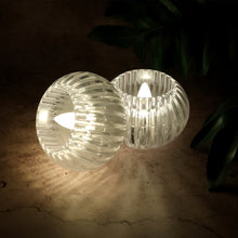 Four battery powered LED decorative candles emitting safe, smokeless light