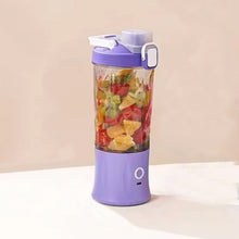 The portable juicer connected to its USB charging cable, highlighting its convenience.