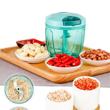 Handheld vegetable chopper with pull-cord mechanism for easy use.