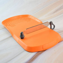 Apex Cut 'n' Wash cutting board with detachable stainless steel knife on surface
