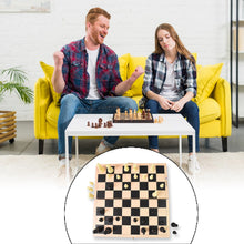 The folding wooden chess board fully opened and ready for a game.