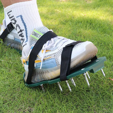 Pair of green Lawn Aerator Sandals with sharp spikes, ready for garden use.