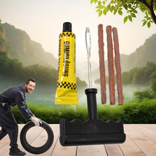 A man in work clothes rolling a tire, with a large tire repair kit (rubber solution, repair strips, T-handle tool) floating