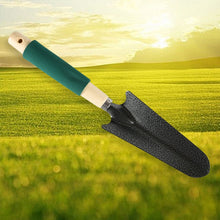 Robust hand cultivator with three strong prongs and a natural wooden handle.