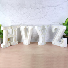 Battery operated LED decorative night light glowing on table in kids room