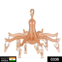 Colorful octopus folding dryer with 16 pegs for efficient drying of socks and small laundry items.