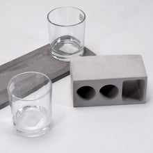 Elegant wine glass holder set with two glasses on a marble base, ideal for home decor.