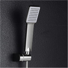 Person holding the handheld shower head, demonstrating its easy grip and versatile use.
