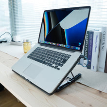 Laptop cooling pad with a gaming laptop placed on top, showing effective cooling in use.