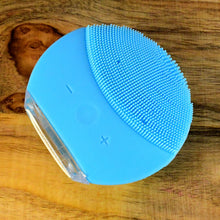 Side view of waterproof rechargeable facial cleansing brush
