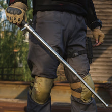 A hand gripping the comfortable foam handle of the Indo Glow Folding Walking Stick.