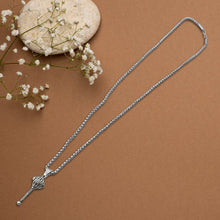 Detailed shot of the pendant and chain connection.