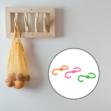 Plastic S hooks holding clothes and accessories neatly