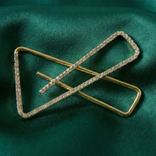 Crystal embellished golden brooch pin securing saree pleats
