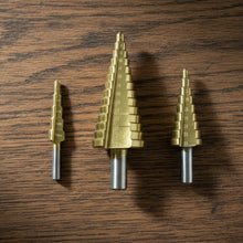 The full set of titanium coated HSS steel step drill bits, ready for various tasks.