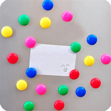Side profile of translucent yellow circular magnetic button