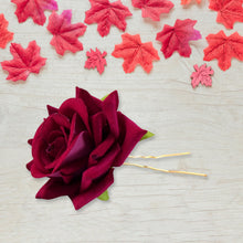 Flower hair pin in mixed colors adding floral charm to loose wavy hairstyle