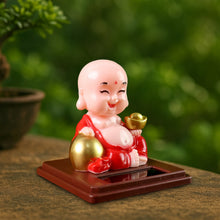Packaging for the Solar Buddha Car Ornament, detailing product features and dimensions.