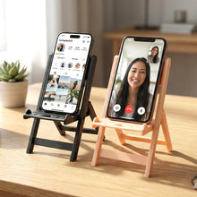 Mini chair mobile stand holding smartphone on desk for hands-free use
