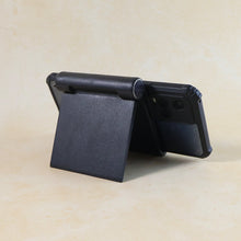 Side view of sleek black plastic foldable desktop mobile stand
