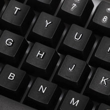 Angled view of the wired keyboard, highlighting its full-size layout and ergonomic key placement.