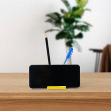 Mobile phone stand with dual pen holder, sturdy plastic design for desk