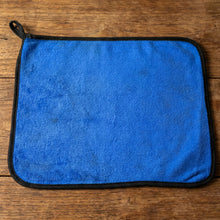 Lifestyle image of a clean glass surface wiped with microfiber cloth