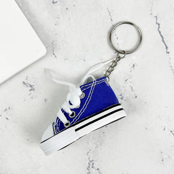 Assortment of colorful mini shoe keychains displayed together.