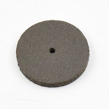 Detailed view of a single durable resin grinder cutting disc for metalwork.